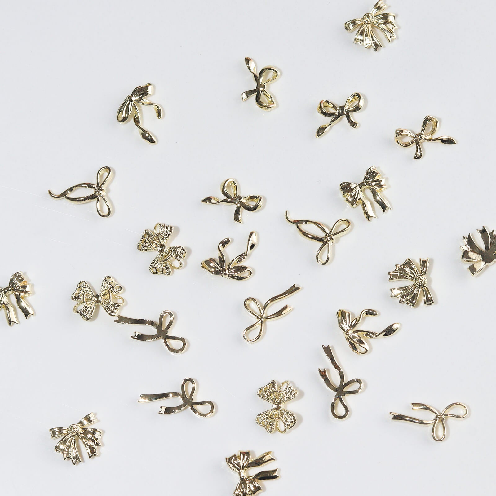 60pcs-metal-bow-nail-charms-set-gold-show