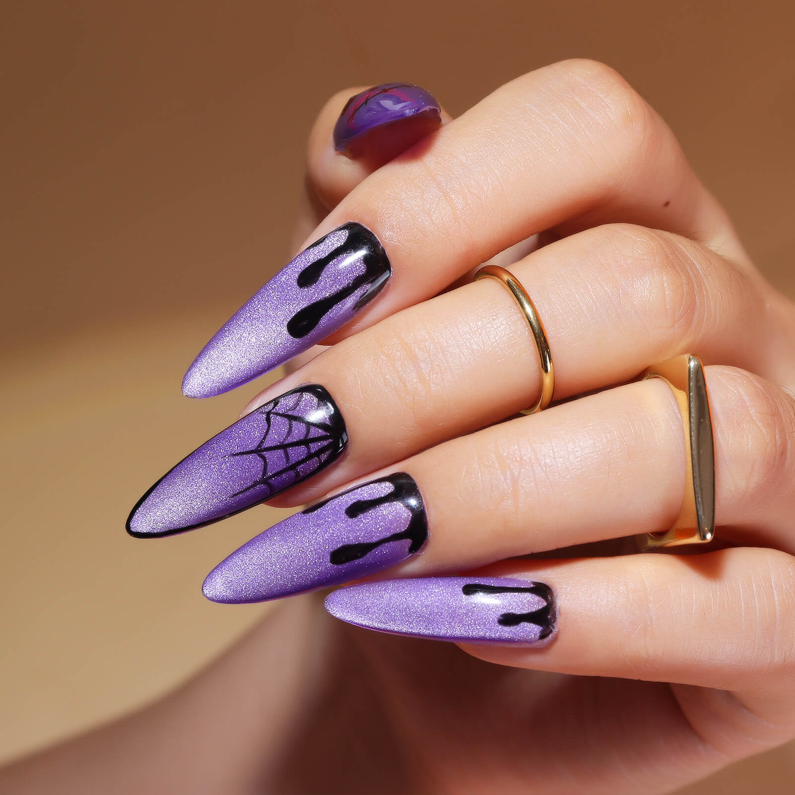 Halloween-purple-cat-eye-nail-design