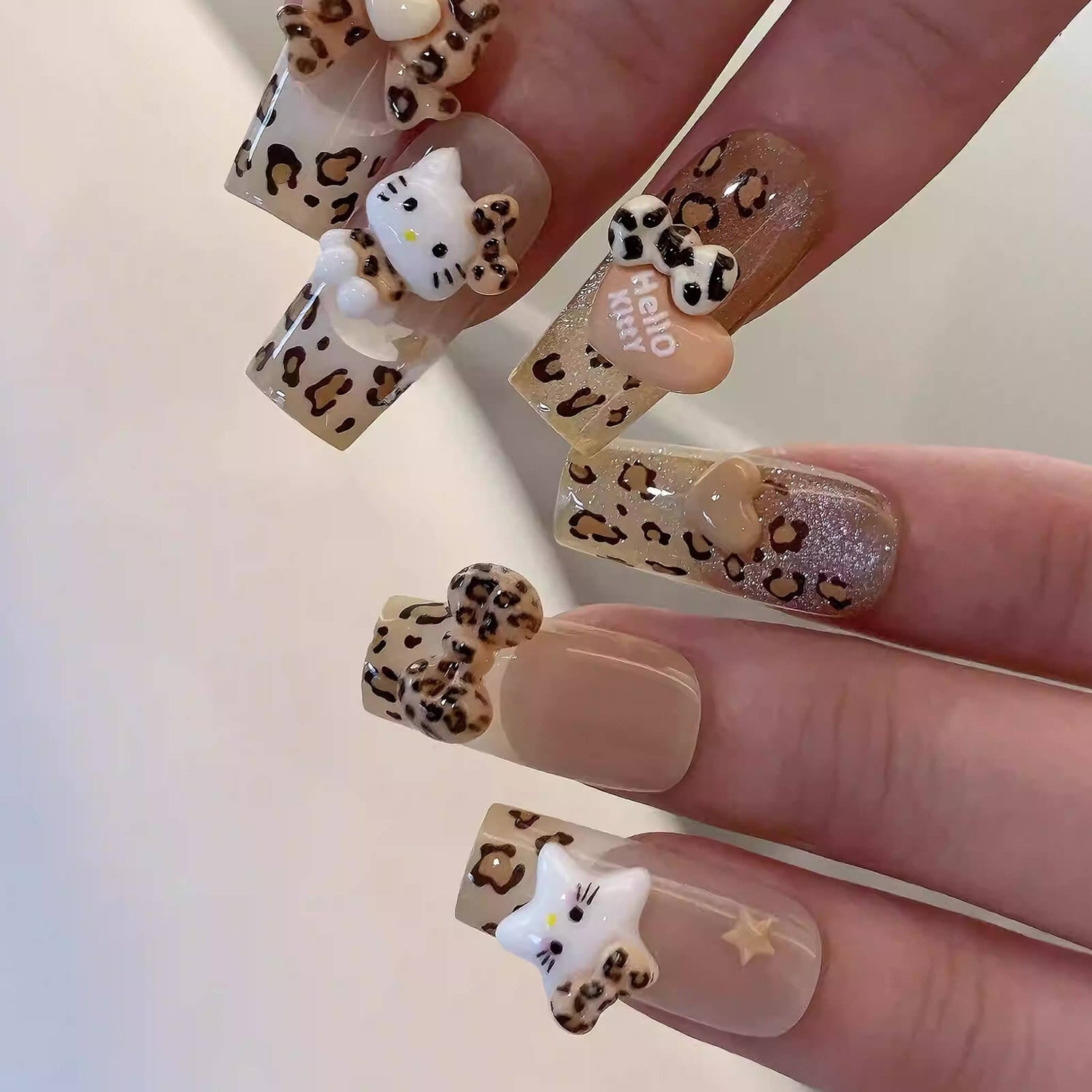 leopard-kitty-bow-charms-nail-design